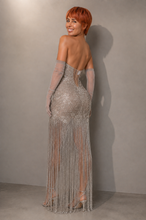 Load image into Gallery viewer, Back view of the Celestial Fringe Couture Gown showcasing crystal embroidery, shimmering fringe, sculpted silhouette, and elegant floor-length design.