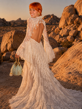 Load image into Gallery viewer, Back view of ivory lace formal gown with dramatic floor-length silhouette and sweeping lace train.