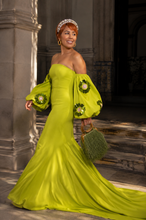 Load image into Gallery viewer, Luxury chartreuse evening gown with an off-the-shoulder neckline, dramatic puff sleeves with floral sequin embellishments, fitted mermaid silhouette, and elegant floor-length train.