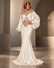 Load image into Gallery viewer, Celeste ivory satin evening gown with off-the-shoulder draping, dramatic long sleeves, sheer floral lace center panel and floor-length silhouette.