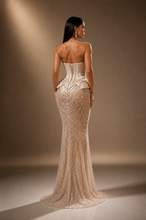 Load image into Gallery viewer, Back view of the Celestia Pearl Gown featuring an elegant fitted silhouette with intricate pearl embroidery and couture detailing.