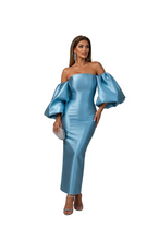 Load image into Gallery viewer, Elegant light blue satin off-shoulder evening gown with oversized sculptural sleeves, fitted silhouette, and crystal clutch.