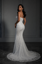 Load image into Gallery viewer, Elegant pearl mermaid evening gown with sweetheart neckline, crystal embellishments, lace embroidery, fitted corset bodice, chapel train, and luxury bridal-inspired silhouette.