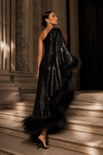 Load image into Gallery viewer, Luxury black one-shoulder sequin evening gown with statement feather trim, fitted silhouette, and floor-length design for galas, black-tie events, and formal occasions.