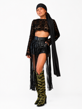 Load image into Gallery viewer, Luxury editorial fashion featuring a black floral lace crop top with faux leather fringe shorts styled in two different ways: one with crystal heels and one with statement boots and a black headscarf, showcasing the versatility of The Mineli Edit.