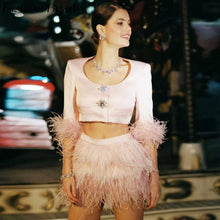 Load image into Gallery viewer, Blush pink Jazz Era-inspired two-piece set featuring a cropped jeweled jacket with feather cuffs and coordinating feather mini skirt.