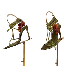 Load image into Gallery viewer, Luxury olive green stiletto sandals featuring sparkling crystal straps, decorative grape embellishments, and elegant lace-up ankle ties, designed for Mediterranean vacations, resort wear, and editorial fashion.
