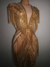 Load image into Gallery viewer, Golden Gatsby Art Deco Fringe Gown featuring cascading gold fringe, geometric embellishments and nude illusion detailing from the Global Couture Jazz Era Collection.