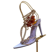 Load image into Gallery viewer, Luxury  stiletto sandals featuring sparkling crystal straps, decorative grape embellishments, and elegant lace-up ankle ties, designed for Mediterranean vacations, resort wear, and editorial fashion.