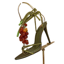 Load image into Gallery viewer, Luxury olive green stiletto sandals featuring sparkling crystal straps, decorative grape embellishments, and elegant lace-up ankle ties, designed for Mediterranean vacations, resort wear, and editorial fashion.