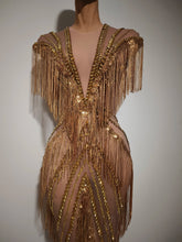 Load image into Gallery viewer, Golden Gatsby Art Deco Fringe Gown featuring cascading gold fringe, geometric embellishments and nude illusion detailing from the Global Couture Jazz Era Collection.