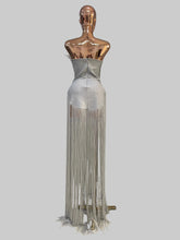 Load image into Gallery viewer, Silver Jazz Era gown featuring a structured crystal-embellished bodice with Art Deco geometric detailing and dramatic floor-length silver fringe.