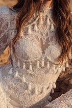 Load image into Gallery viewer, Close-up of intricate ivory lace gown featuring delicate tassel trim, sheer lace detailing and structured bodice.