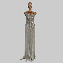 Load image into Gallery viewer, Silver Jazz Era gown featuring a structured crystal-embellished bodice with Art Deco geometric detailing and dramatic floor-length silver fringe.